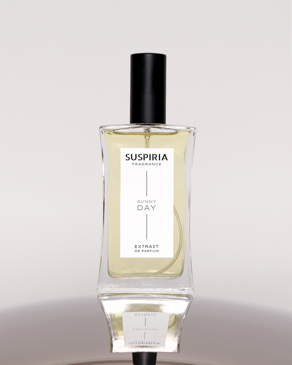 Perfume bottle labeled 'Suspiria' on a light gray background
